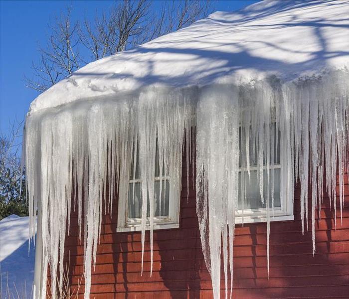 icicles hanging from red house